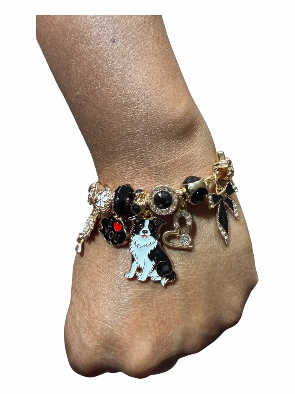 Gold Tone Charm Adjustable Twisted Bangle W/Black & White Dog and Heart Charms